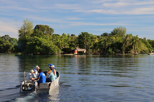 travelers riding on boat in Solomon Islands