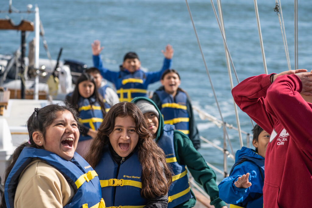 smiling excited children on a boat