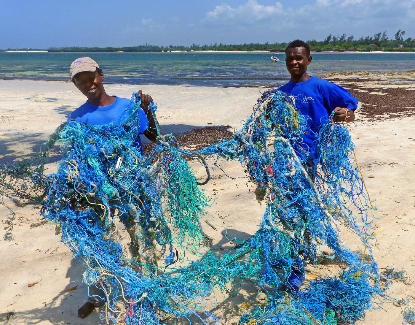 Removing discarded fishing nets from the beach (1)